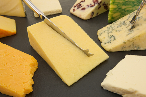 Nine varieties of British cheese on a Slate cheese board.