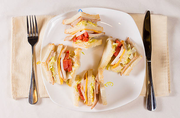 �над головой из трех decker бутерброд с пластинкой - quartered стоковые фото и изображения