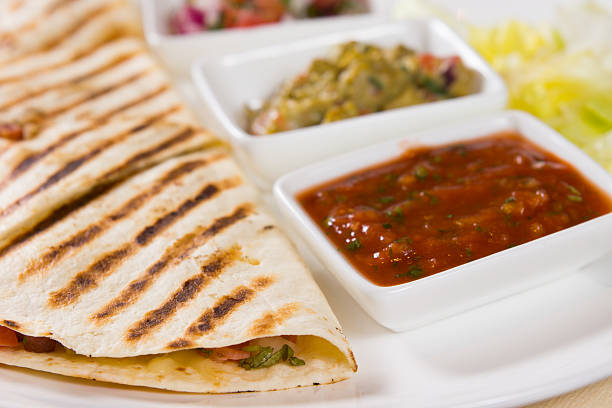 istock Close Up of Grilled Quesadilla with Salsas 524858477