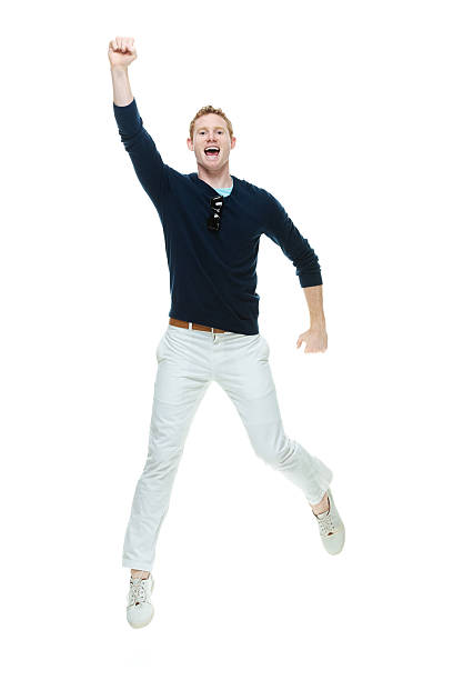 istock Cheerful casual man jumping & cheering 524858761