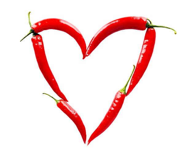 istock Heart made of red chili peppers on white 524859619