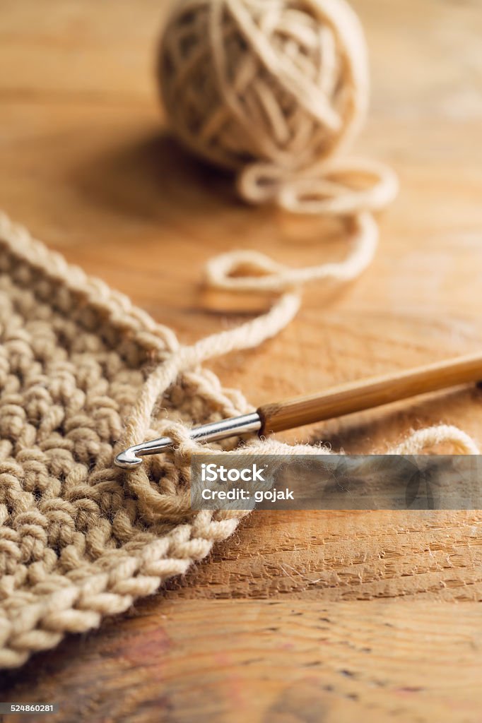 hook Crochet hook on wooden table Art And Craft Stock Photo