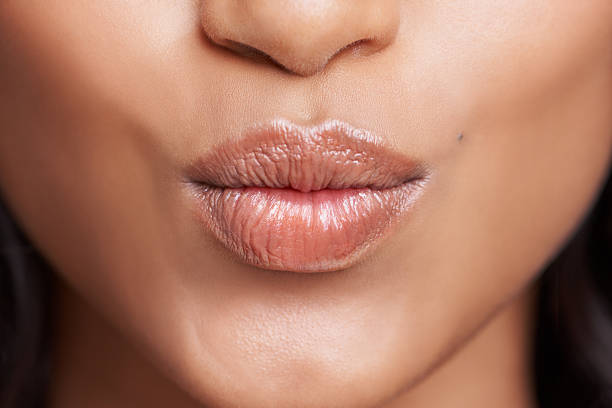 And one for you Cropped shot of a woman's beautiful lips puckering stock pictures, royalty-free photos & images