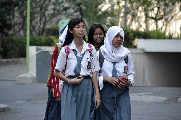 Senior High School student Bandung, Indonesia - September 17, 2014: Senior High School student get walking together to their home. indonesia school students stock pictures, royalty-free photos & images