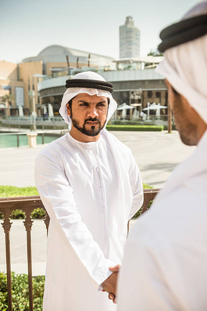 istock sheikh doing a deal in UAE 524879389