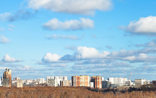 istock blue sky with white clouds over city in autumn day 524879423