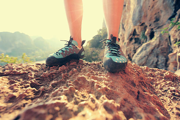 istock one young woman rock climber  on rock 524880542
