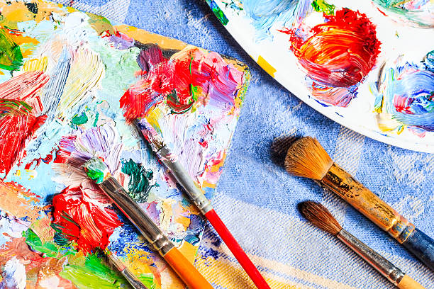 istock Colourful oil paint, different types of brushes and palette 524880824
