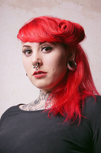 istock girl with piercings and tattoos 524881632