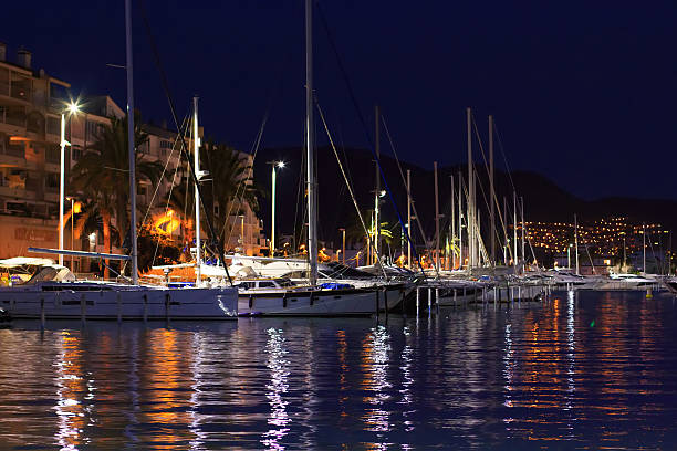istock Modern yachts in quay at night 524881768