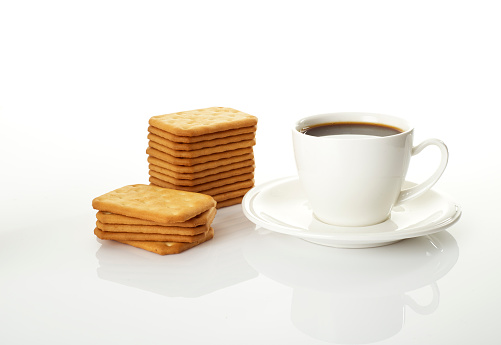 Delicious biscuits with hot coffee for breakfast.