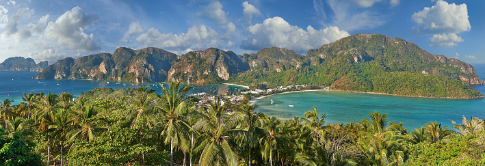 Travel vacation background - Tropical island with resorts - Phi-Phi island, Krabi Province, ThailandBuddhist and Hindu motifs.