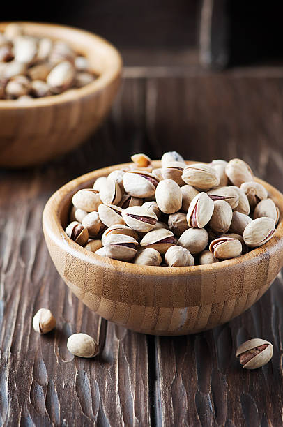 istock Salt pistachio nuts in the wooden bowl 524884176