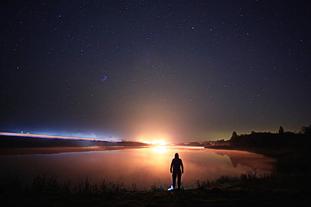 istock starry night sky lake landscape 524885029