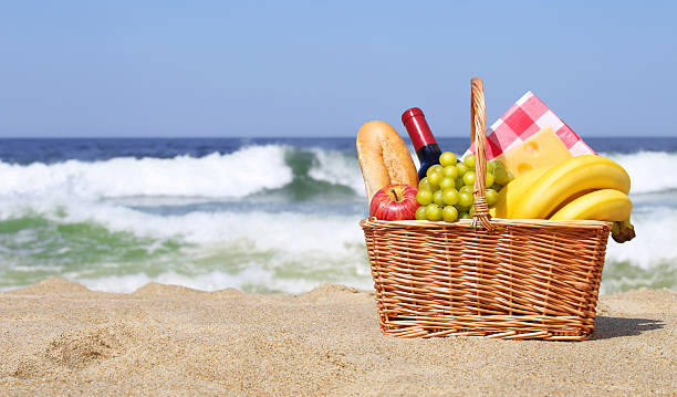 istock Picnic basket with food on the beach 524889806