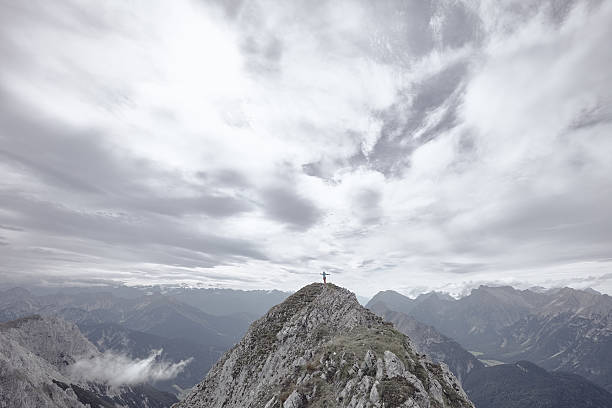istock Female climber on top of mountain 524890378