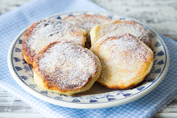 istock ruddy cheesecakes with powdered sugar and berries. 524891962
