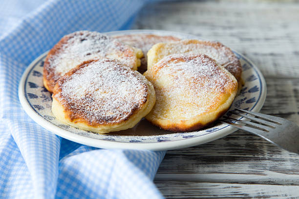 istock ruddy cheesecakes with powdered sugar and berries. 524892456