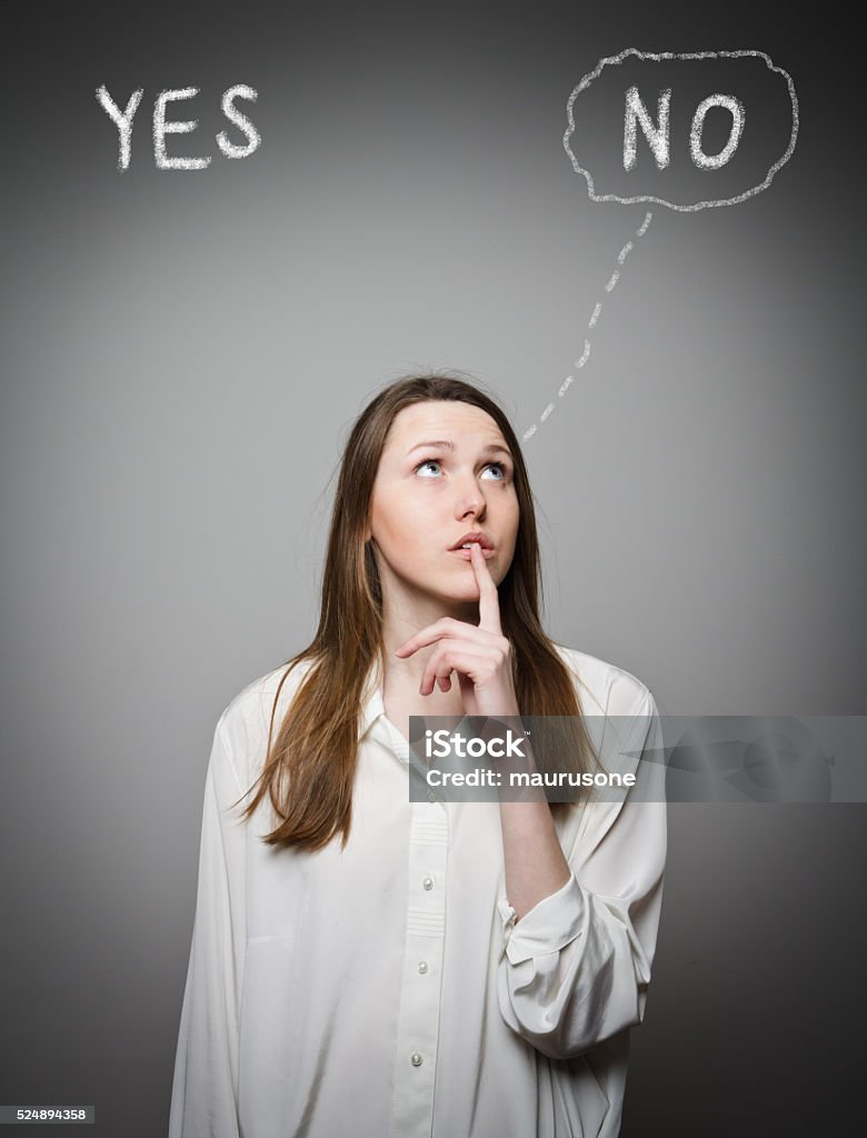 Yep concept Girl in white is full of doubts and hesitation. Yep concept. Young woman is thinking. Curiosity Stock Photo