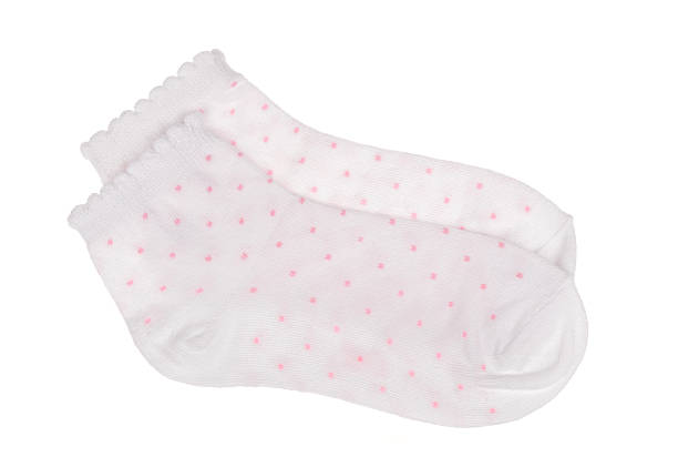 istock White polka dot childish socks isolated. 524894380