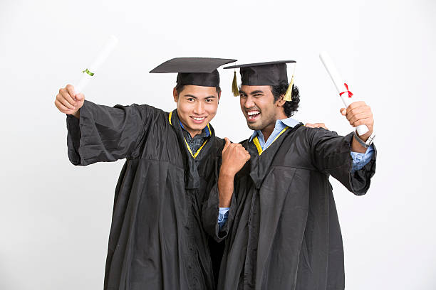 istock Cheerful two male graduates 524894386