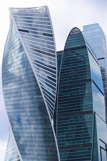 istock Blue skyscrapers heads in business centre 524894422