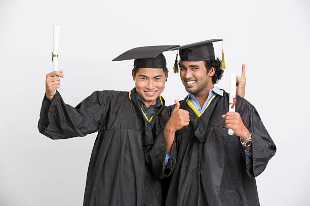 istock Cheerful young two male graduates 524895074