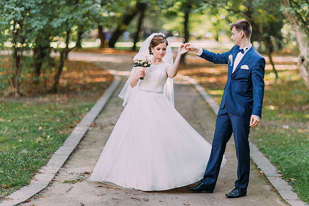 istock Happy wedding couple charming groom and brunet bride dancing in 524895558