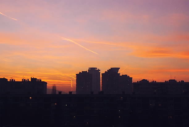 Beautiful blue and orange sky colors at sunshine over city landscape aerial view