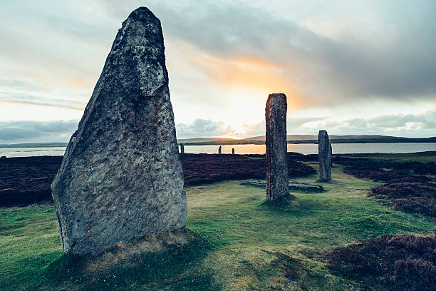 Part of the Neolithic stone circle known as the Ring of Brodgar, on the Orkney Islands of Scotland just after dawn. The site dates back to between 2500BC to 2000BC and is part of a wider archaeological complex containing Skara Brae, the Stones of Stenness and Maeshowe. Filmic treatment in AdobeRGB colorspace.
