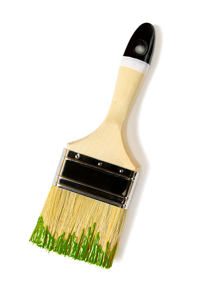 istock Paintbrush with green paint (isolated on white) 524899262