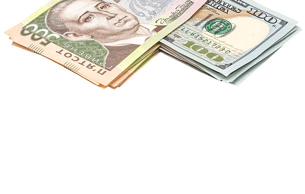 istock Stack of hryvnias and dollars isolated on white 524900308
