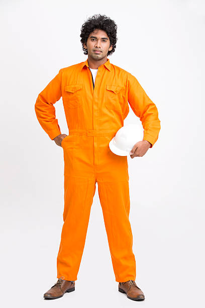 istock Indian municipal young worker standing with safety helmet 524900472