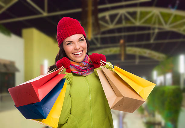 Warmly Dressed Mixed Race Woman with Shopping Bags Pretty Warmly Dressed Mixed Race Woman In Outdoor Mall with Shopping Bags. hot mexican girls stock pictures, royalty-free photos & images