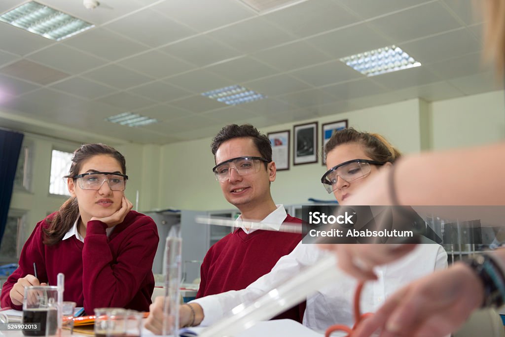 Turkish Students with Protective Glasses , Chemistry Lab, Research, Istanbul Three Turkish students with protective glasses, at Istanbul secondary school, university, studying chemistry, Istanbul, Turkey. Nikon D800, full frame, XXXL. Shalow DOF. Adult Stock Photo