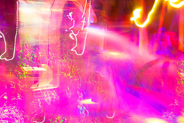 istock abstract pink and yellow coloured lights unfocused 524902031