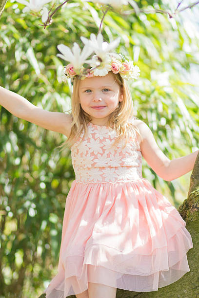 Blonde Girl in a magnolia tree