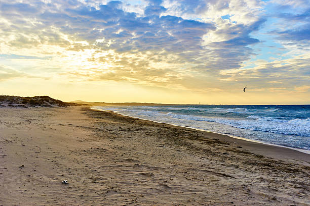 istock Kitesurfing at sunset in sardinia 524902584