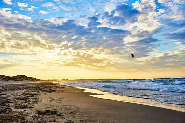 istock Kitesurfing at sunset in sardinia 524903030