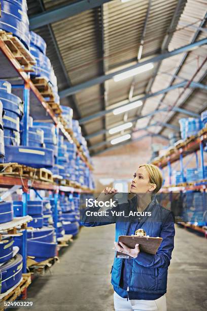 Yep Thats It Right Up There Stock Photo - Download Image Now - One Woman Only, Warehouse, Women