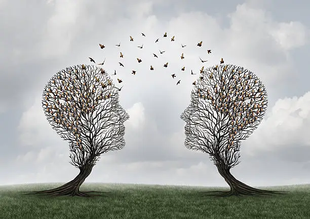 Concept of communication and communicating a message between two head shaped trees with birds perched and flying to each other as a metaphor for teamwork and business or personal relationship with 3D illustration elements.