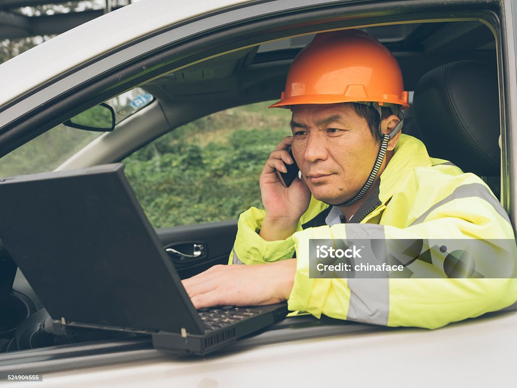 Natural gas plant engineers working on laptop Natural gas plant engineers working on laptop in   car outdoor, checking the Pipeline on internet. 40-44 Years Stock Photo