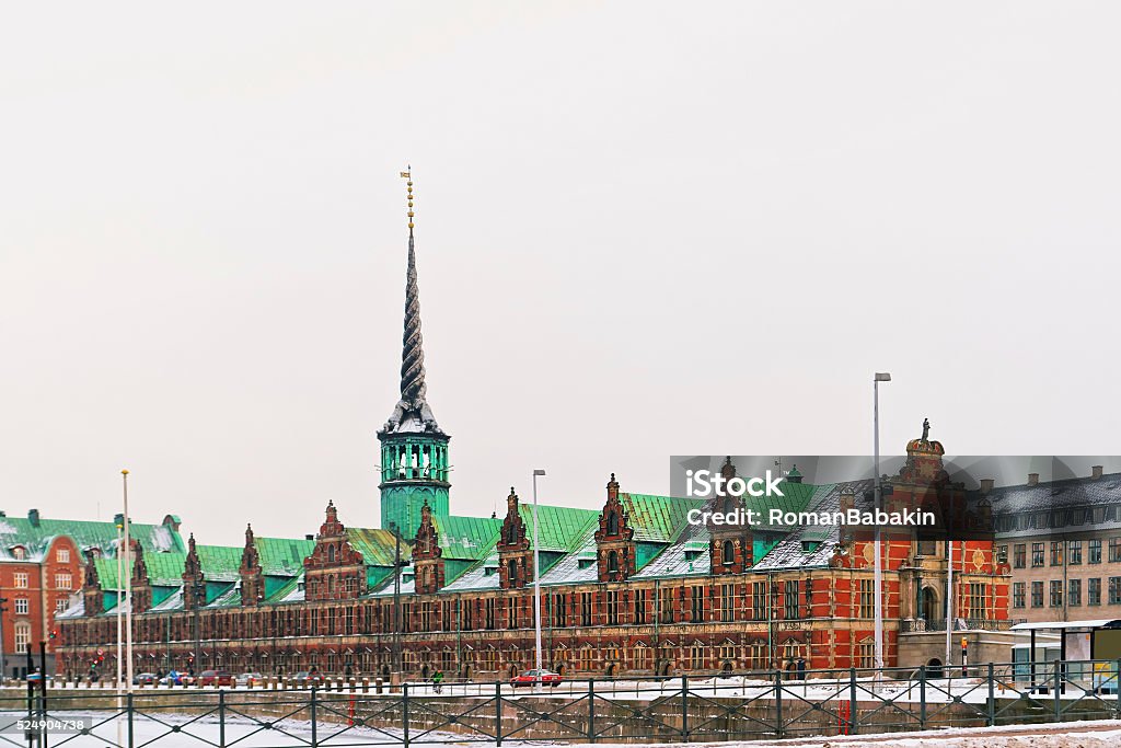 The Stock Exchange on Slotsholmen in Copenhagen in winter Borsen (The Stock Exchange) is a historic building on Slotsholmen. Slotsholmen is an island in harbor of Copenhagen, Denmark. The building now serves as headquarters for Danish Chamber of Commerce. Architecture Stock Photo