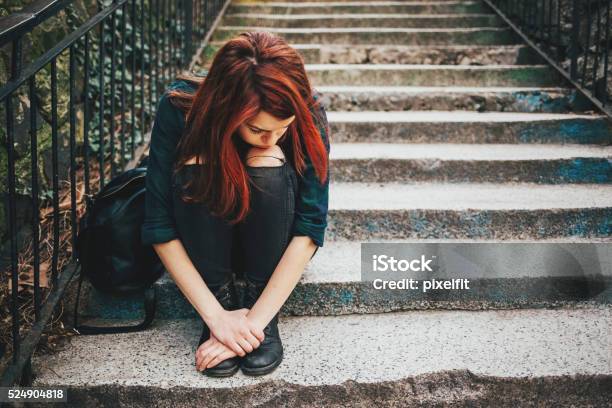 Sad Lonely Girl Sitting On Stairs Stock Photo - Download Image Now - Teenager, Adolescence, Teenage Girls