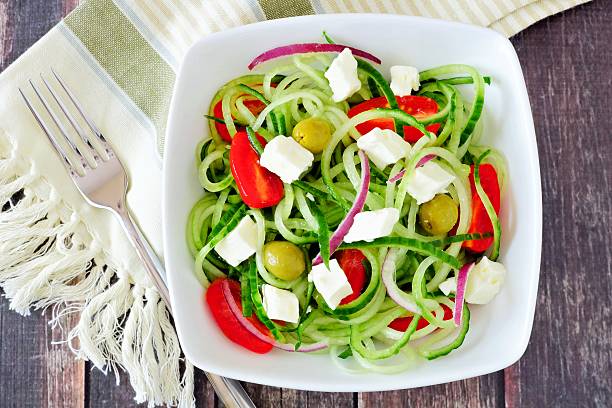 istock Greek Salad with cucumber noodles overhead scene 524905882