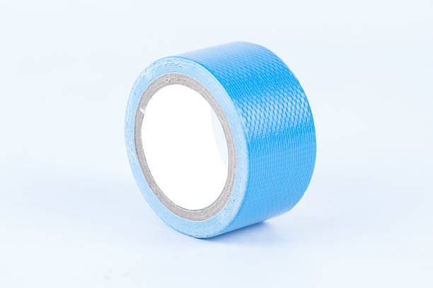 istock roll of blue painters tape 524906377