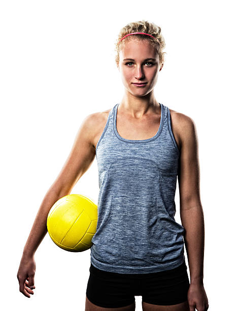 Beach Volleyball Girl Isolated on White This is a photo of a teenage female athlete with a beach volleyball isolated on a white background. young volleyball girl stock pictures, royalty-free photos & images