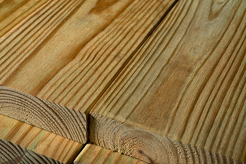 A stack of Pressure Treated Wood. 2X6 Pressure Treated Southern Yellow Pine, typically used for residential decking and other outdoor projects.