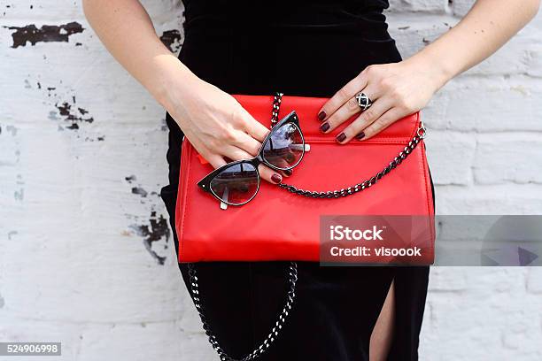 Fashionable Woman With Stylish Red Clutch And Sunglasses Stock Photo - Download Image Now