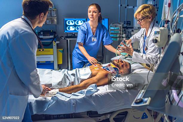 Medical Team Doing The Cpr Activites On Injuried Patient Stock Photo - Download Image Now